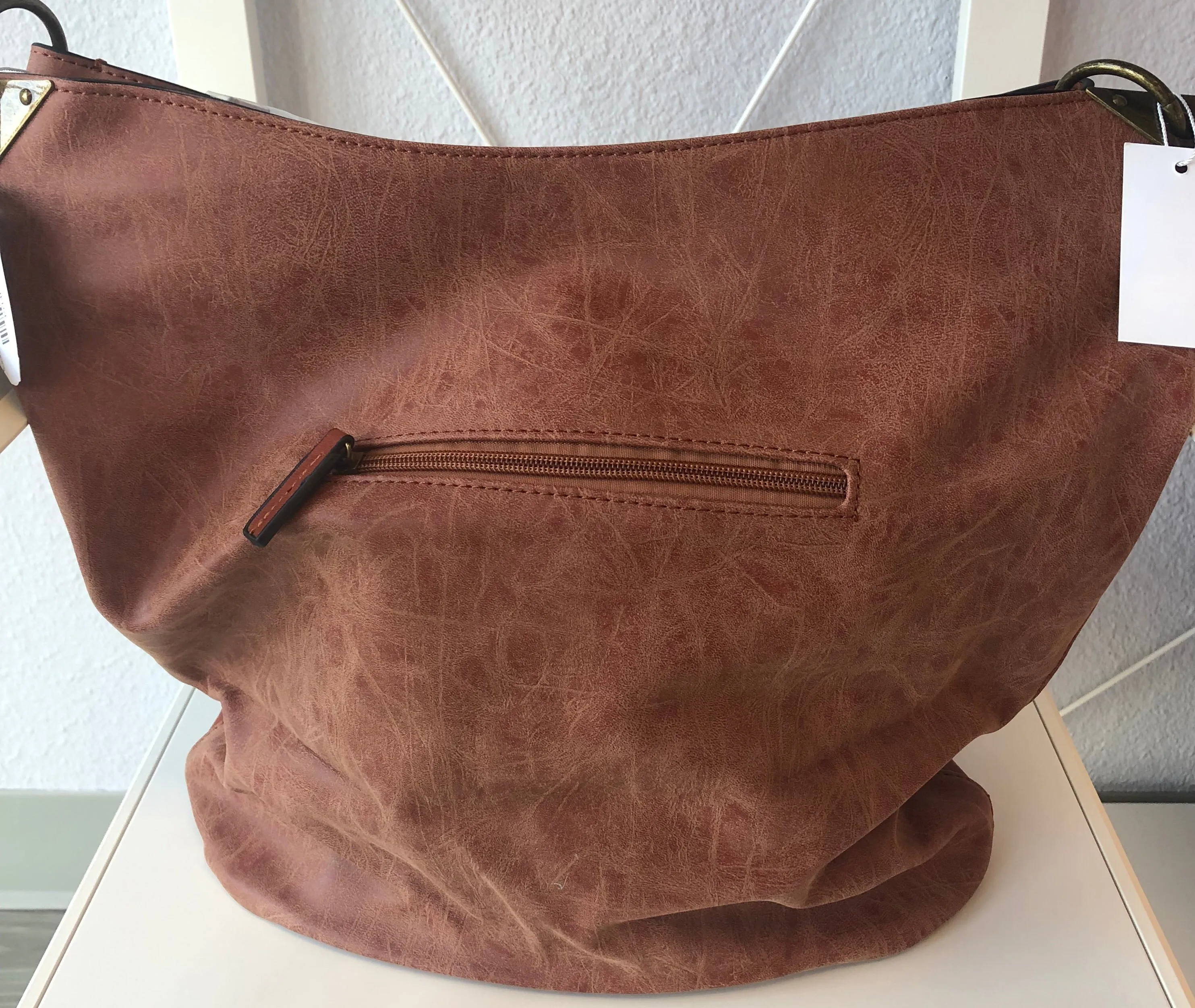 BUCKET HANDBAG WITH DISTRESSED TRIM