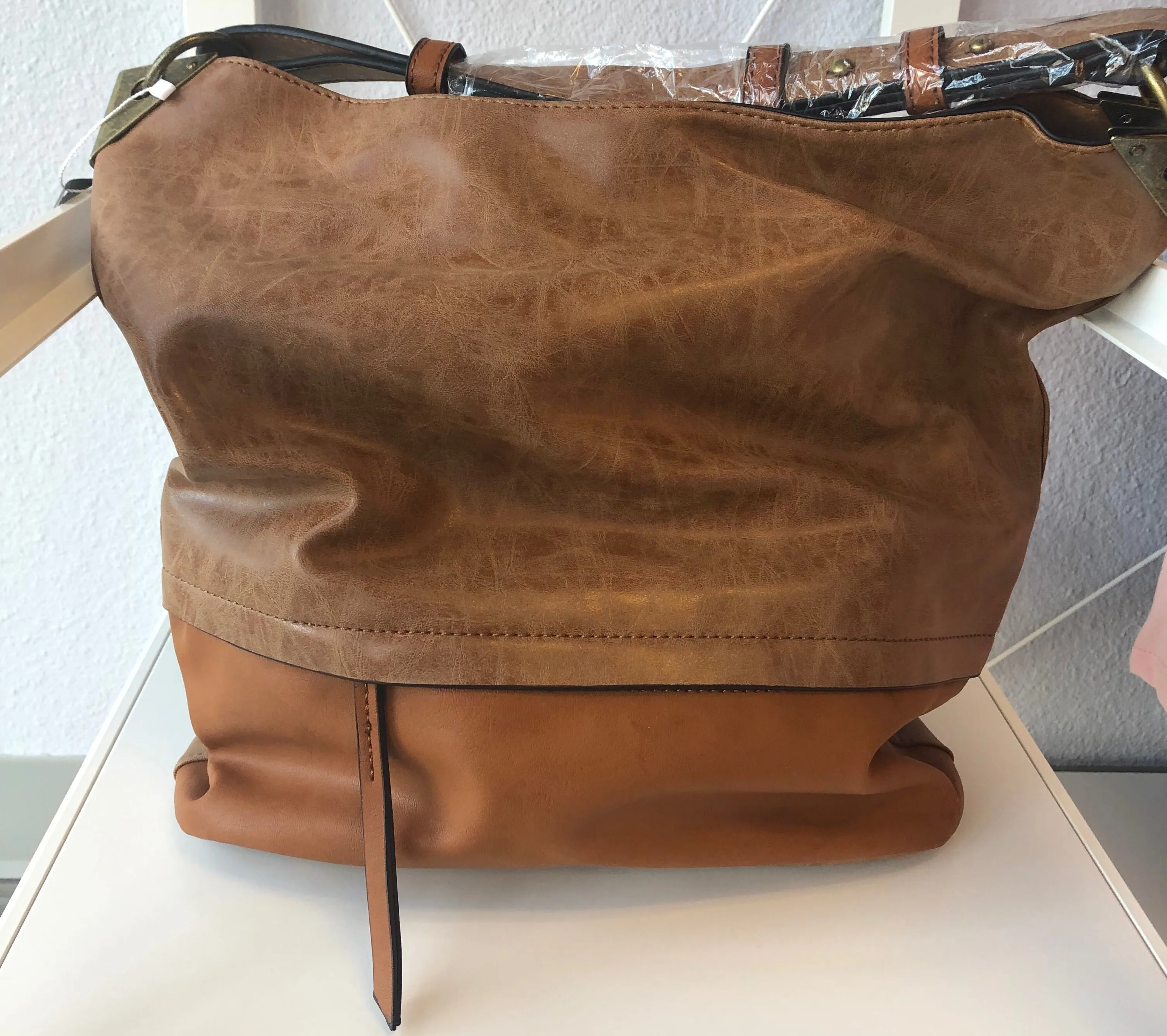 BUCKET HANDBAG WITH DISTRESSED TRIM