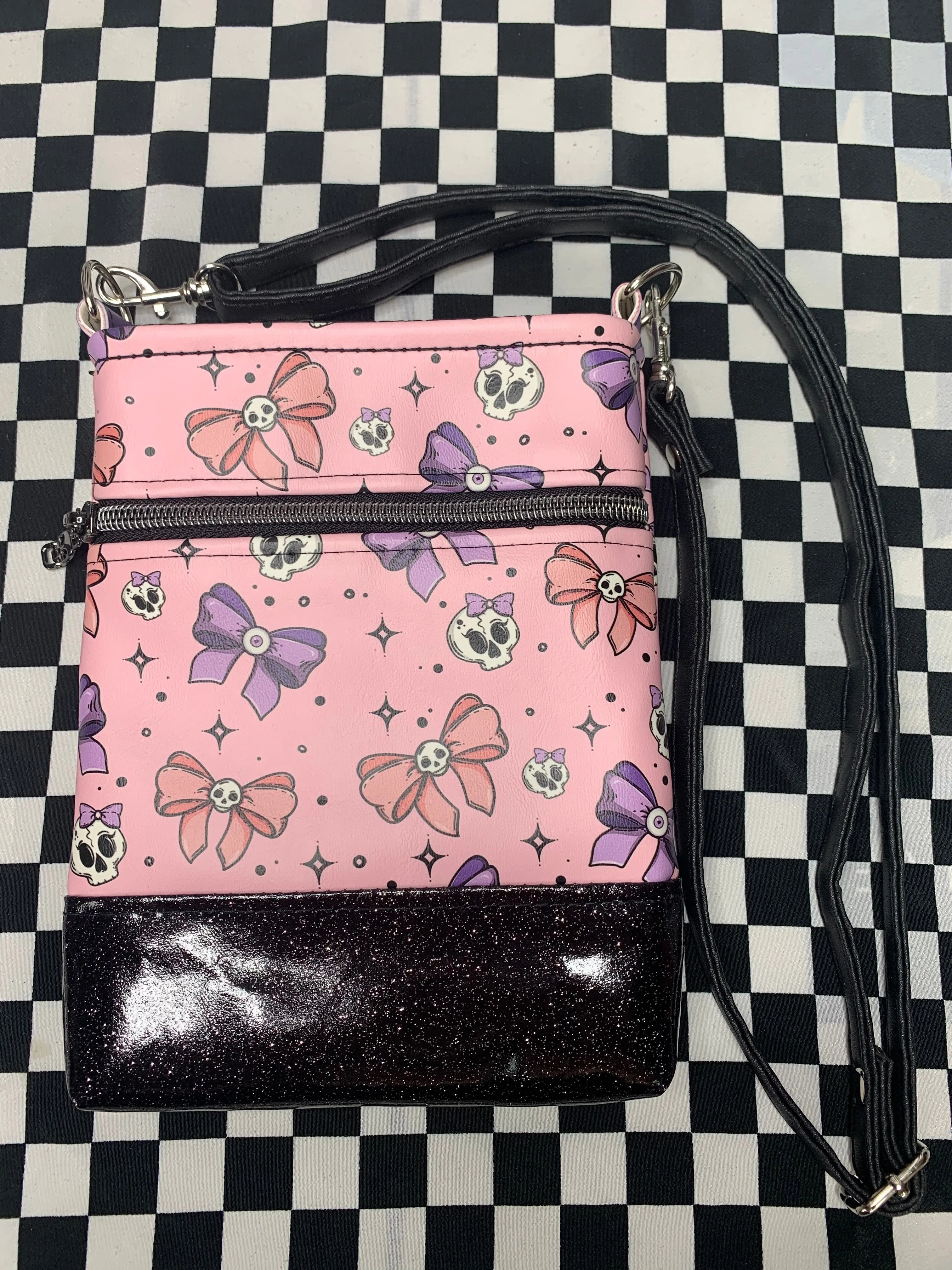 Skulls and bows pink crossbody bag