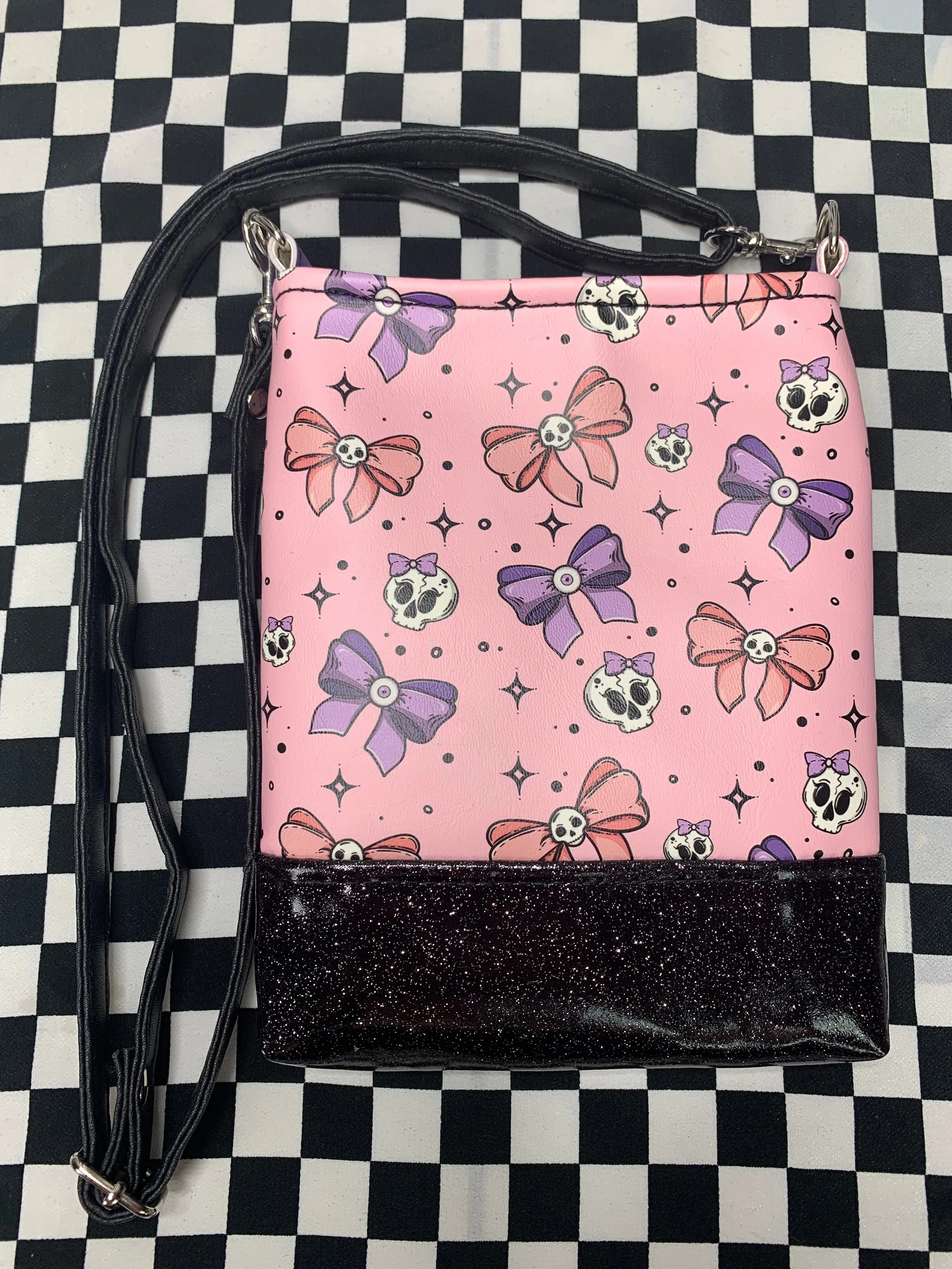 Skulls and bows pink crossbody bag